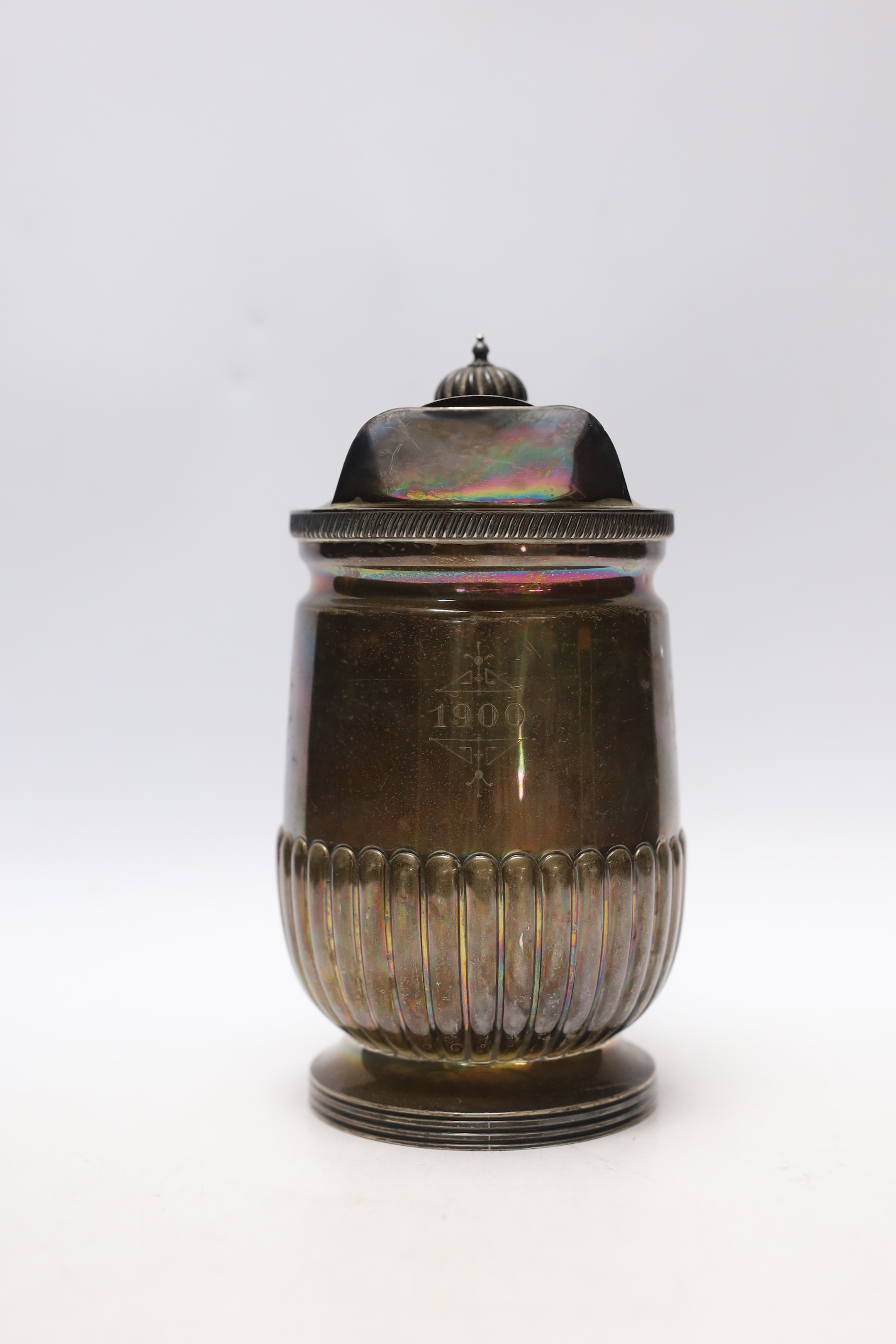 A late Victorian demi-fluted silver hot water jug, Mappin & Webb, Sheffield, 1897, gross weight 17.6oz.